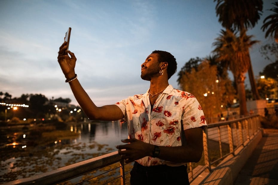 man taking a selfie at a park