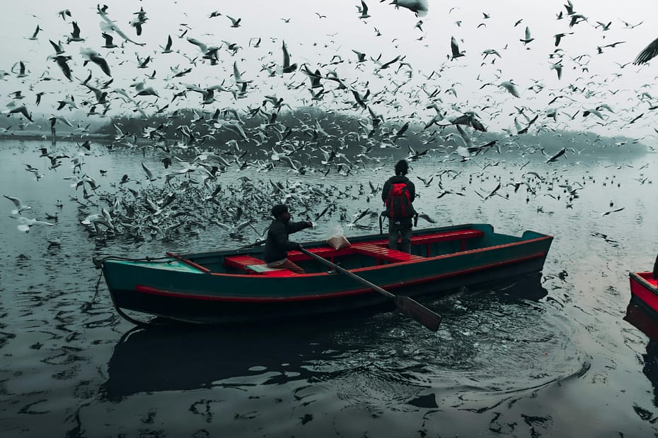 A red selective colour effect of two people fishing